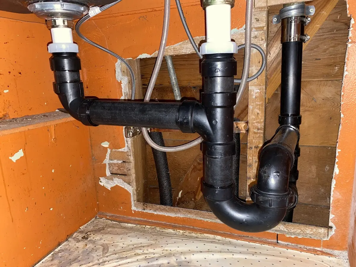 Professional Garbage Disposal Repair equipment and tools on the job in Loughman